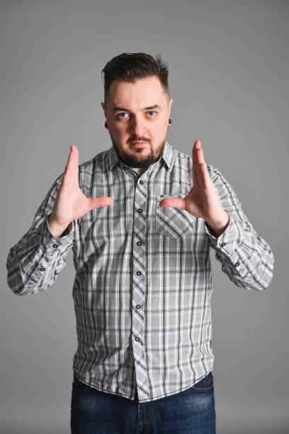istock young bearded man bragging about big size of something 1139127267