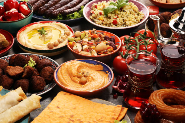 istock Middle eastern or arabic dishes and assorted meze, concrete rustic background. Falafel. Turkish Dessert Baklava with pistachio. Halal food. Lebanese cuisine 1139127580