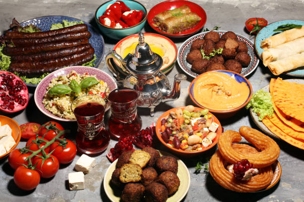 istock Middle eastern or arabic dishes and assorted meze, concrete rustic background. Falafel. Turkish Dessert Baklava with pistachio. Halal food. Lebanese cuisine 1139128259