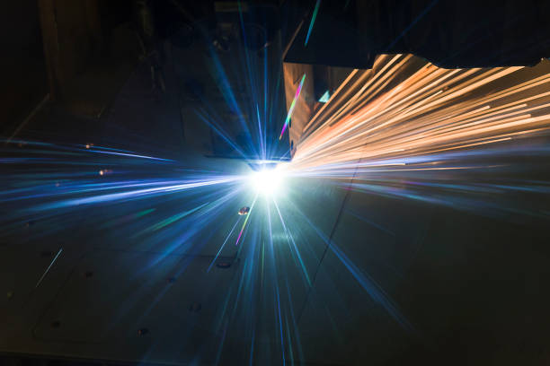 Industrial Laser cutting processing manufacture technology of flat sheet metal steel material with sparks Industrial Laser cutting processing manufacture technology of flat sheet metal steel material with sparks laser cut metal splashes equipment accuracy laser flame stock pictures, royalty-free photos & images