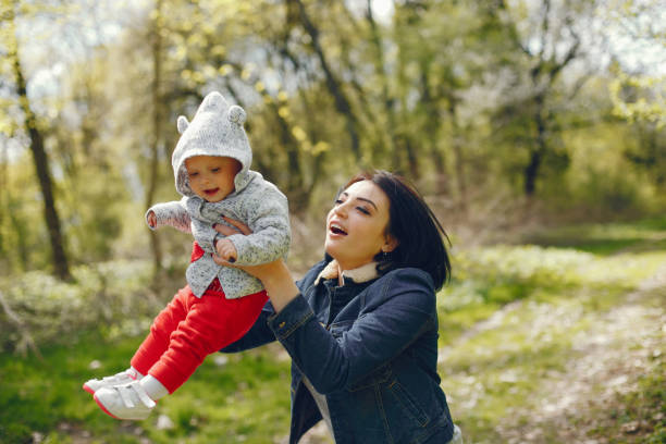 istock Mother with son in a spring park 1139130229