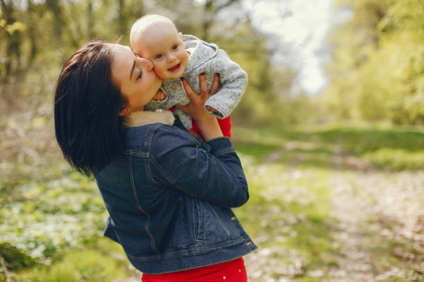 istock Mother with son in a spring park 1139130512