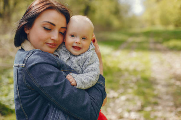 istock Mother with son in a spring park 1139130522