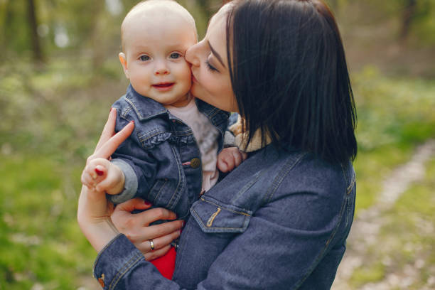 istock Mother with son in a spring park 1139131322