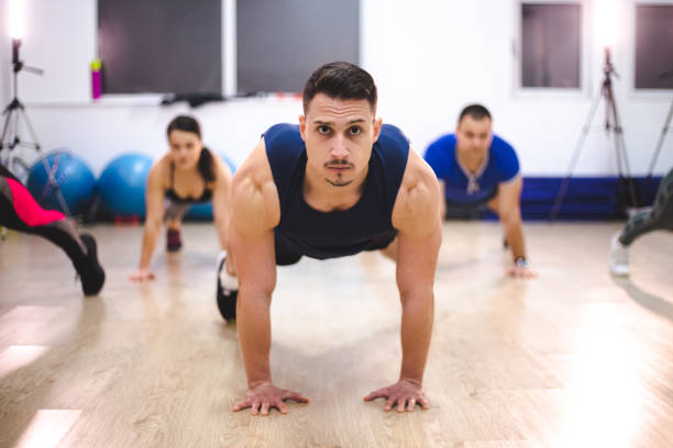 istock Group of people exercising in a gym 1139134807