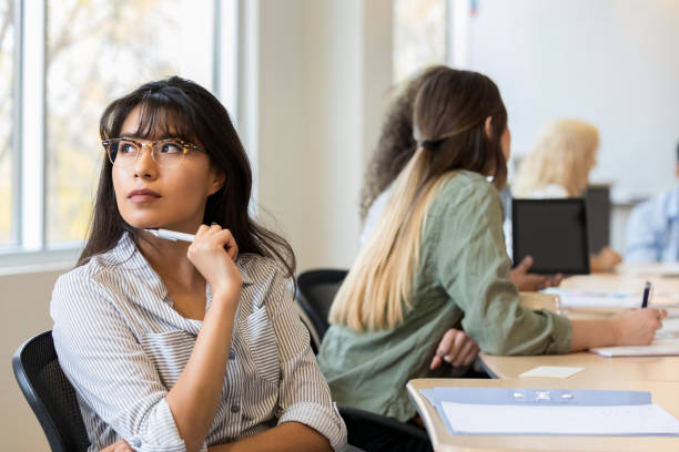 istock Daydreaming young adult female at work 1139138643