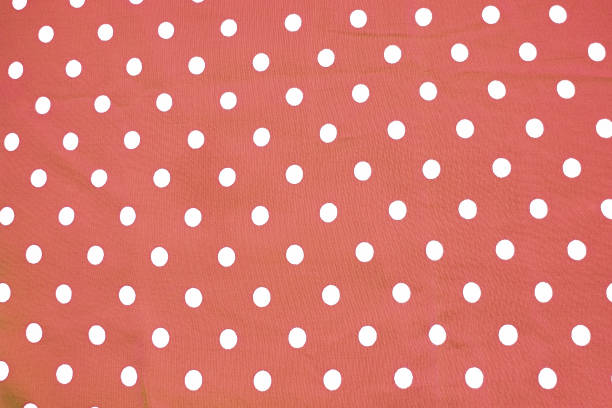 istock Red and white polka dot printed fabric fun romantic background 1139139038