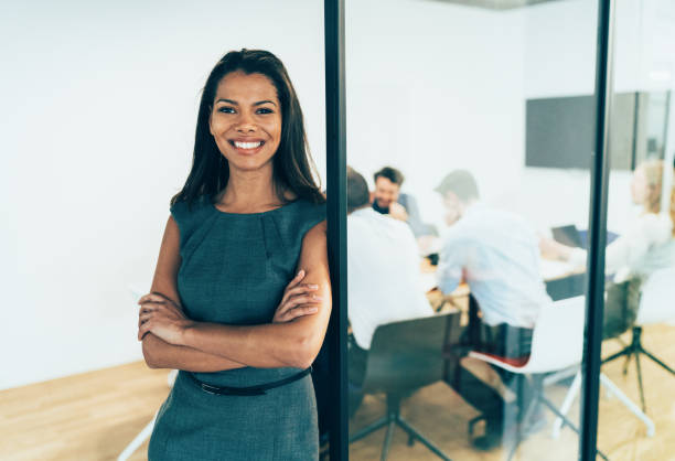 istock Business woman with his team behind 1139140693