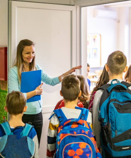istock Schoolchildren entering in classroom 1139141824