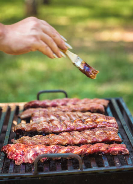 istock Preparing pork ribs on the barbecue grill 1139143600