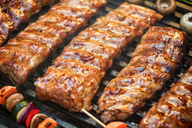 istock Preparing pork ribs on the barbecue grill 1139143691