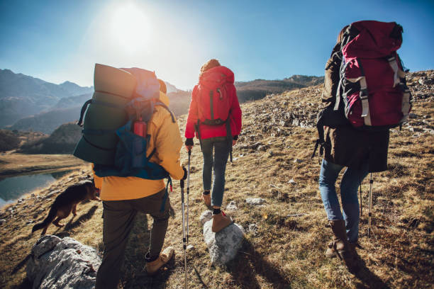 istock Group of hikers walking on a mountain at autumn day 1139143802