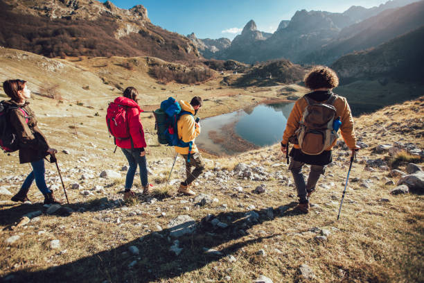 istock Group of hikers walking on a mountain at autumn day 1139146231