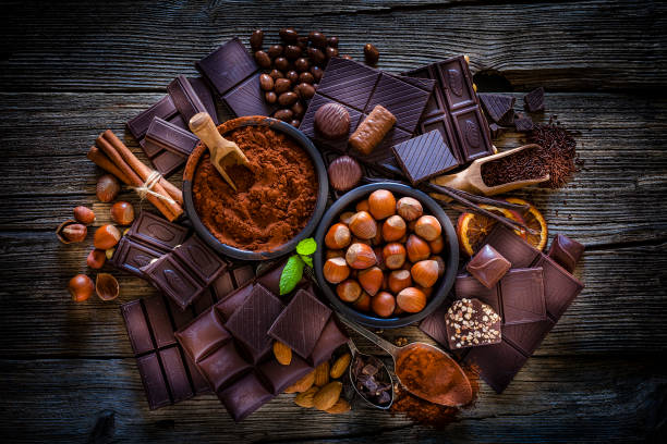 istock Chocolate assortment and cocoa powder shot from above on rustic wooden table 1139146332