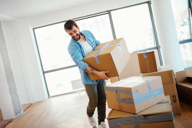 istock Young man moving in a new apartment. 1139147907