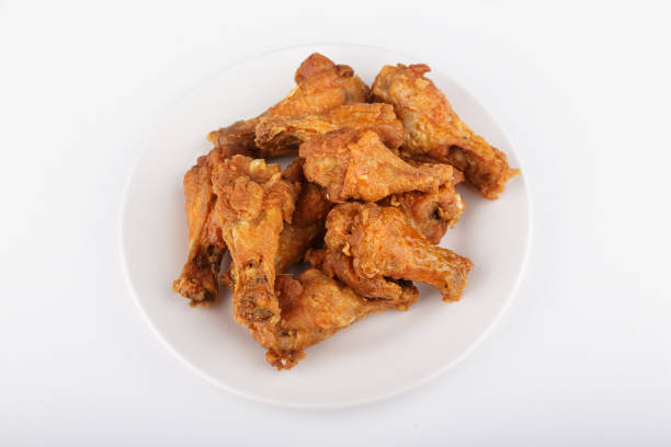 istock Buffalo Wings on White Plate and Counter 1139147912