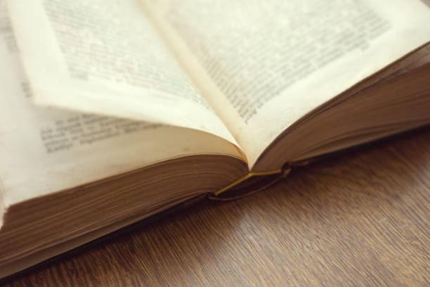 istock Old vintage book on wooden table background 1139148687