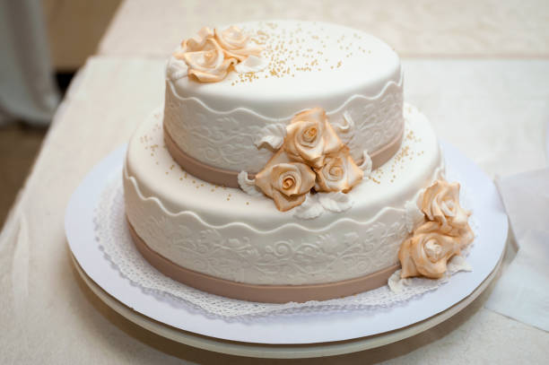 istock White wedding cake with flowers. 1139149222