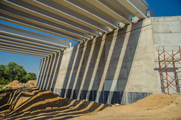 istock Concrete pillars of the bridge with striped sun shadows 1139150062