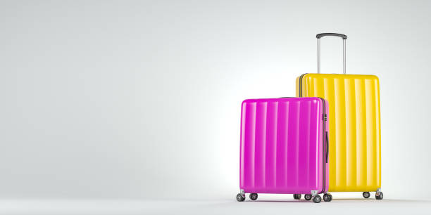 istock Pink and yellow suitcases on white 1139152249