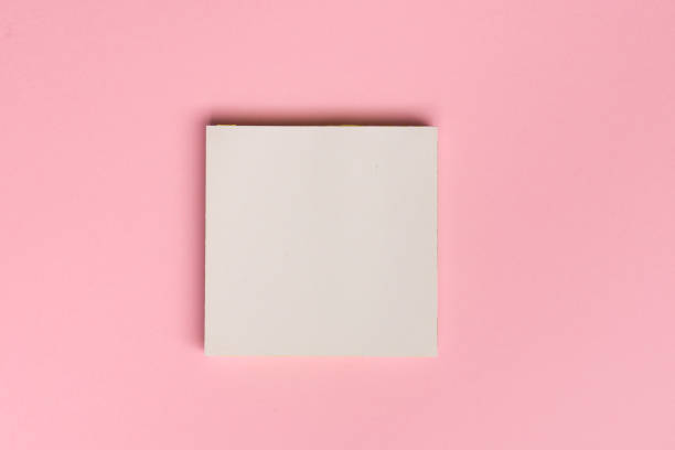 istock Top view flat lay picture with blank notepad page on colored surface 1139152526
