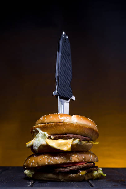 istock Double burger on the table. Two burgers in one. 1139156735