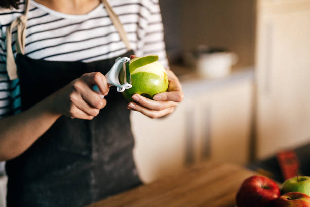 Making a pie Woman making a pie peeling food stock pictures, royalty-free photos & images