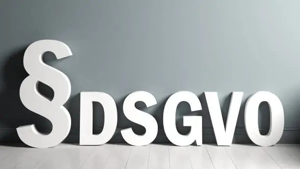 3D rendering of a paragraph symbol and the abbreviation "DSGVO" standing for the German words for "General Data Protection Regulation" in an empty room
