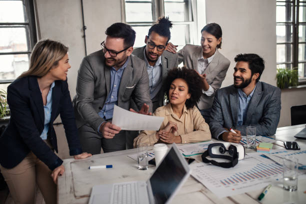 istock Multi-tasking business people working on a meeting in the office 1139165581