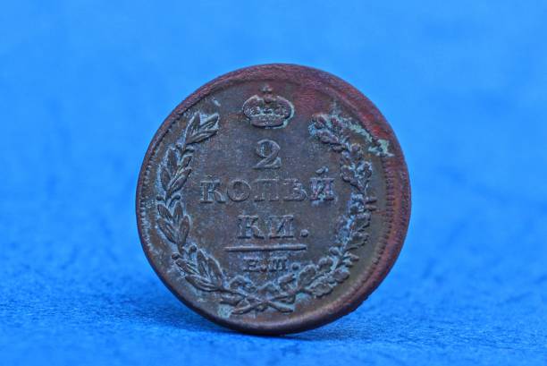 istock big brown old copper coin on a blue table 1139168670