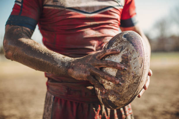 istock Rugby player standing on a playing field with ball 1139169085