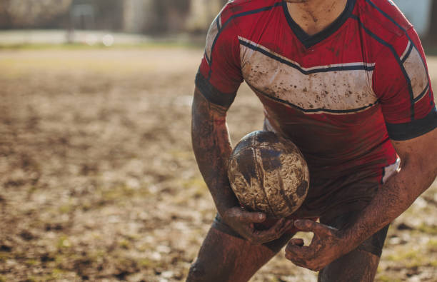 istock Rugby player standing on a playing field with ball 1139170245