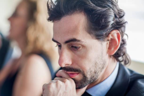 istock Businessman thinking in meeting 1139171395