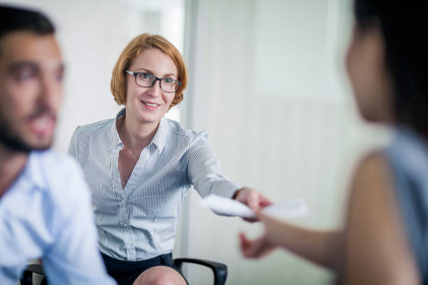 Business man and woman in suit on a light background communication staff job interview. High quality photo