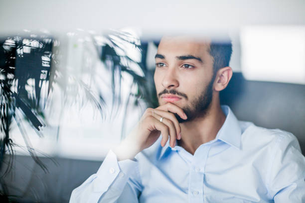 istock Serious businessman gazing ahead in office 1139171688