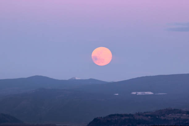 istock Super Moon Rising Above Mountains at Sunset 1139171757