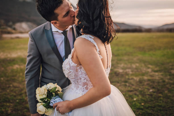 istock Wedding couple kissing in nature 1139171780