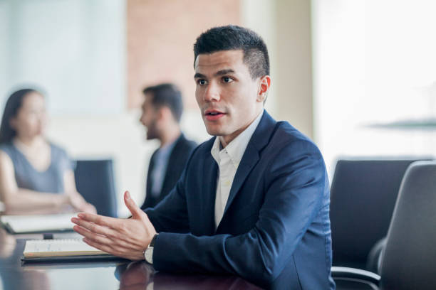 Businessman talking in office at conference table