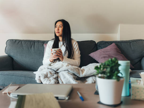 istock Young Asian woman sick at home 1139175402