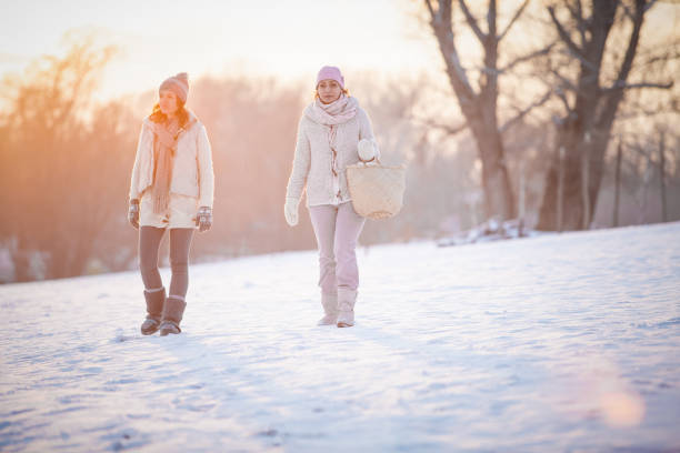 istock Friends walking in snowy field 1139177470