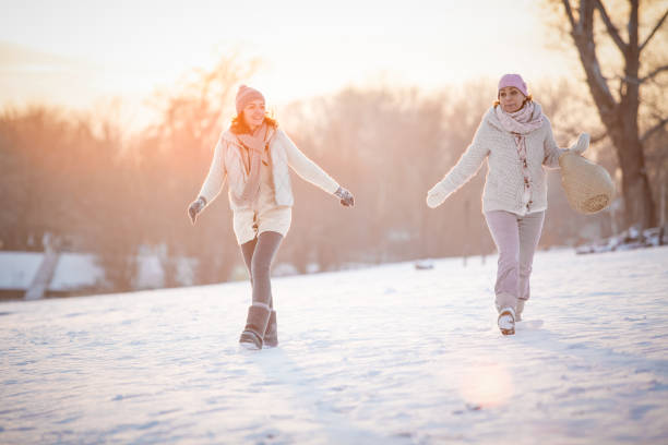 istock Women enjoying a relaxing winter walk 1139177477
