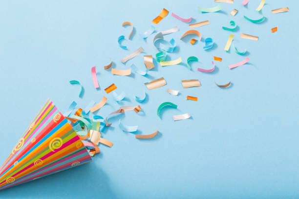 istock birthday hat with confetti on paper background 1139177641