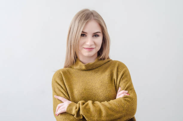 istock Girl in a green sweater posing on a white background. 1139182726