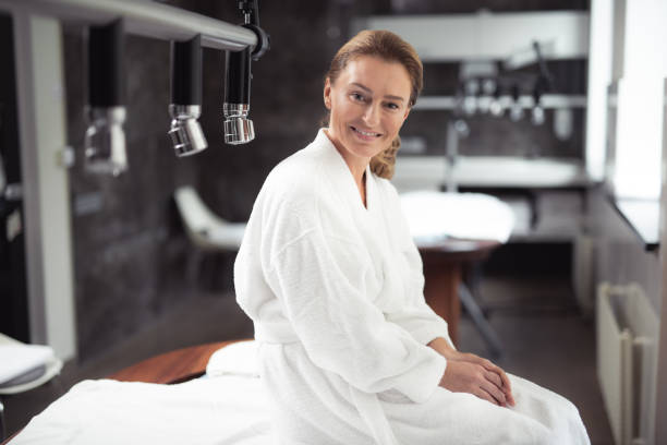 istock Lovely middle aged woman sitting on massage table 1139182812