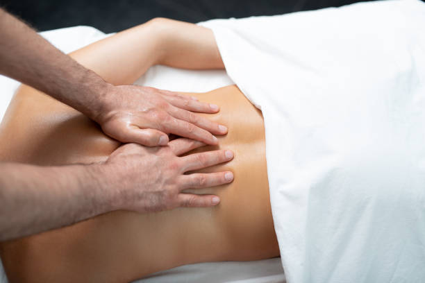 istock Professional masseur doing therapeutic massage on lady back 1139182850