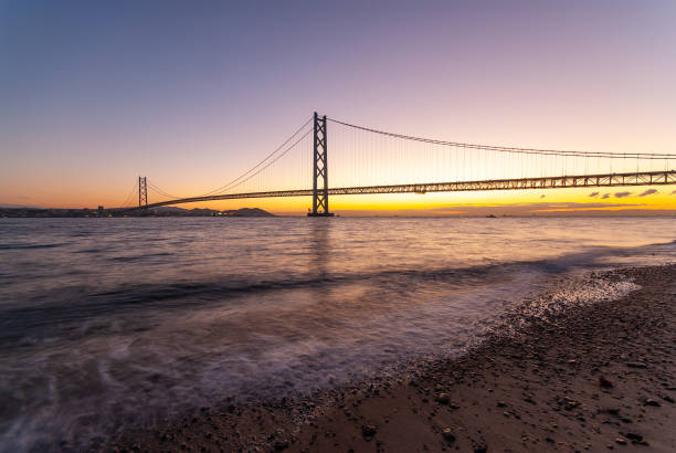 istock Akashi Kaikyo Bridge at dawn seen from the water's edge 1139186855