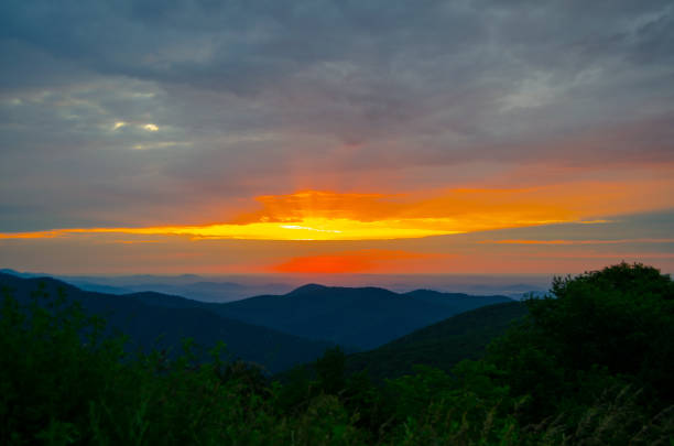 istock Vivd sunlight from sunset over Mountain Range in Shenandoah national park 1139198700