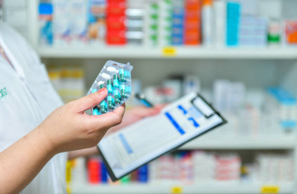 istock Pharmacist filling prescription in blur pharmacy 1139206405