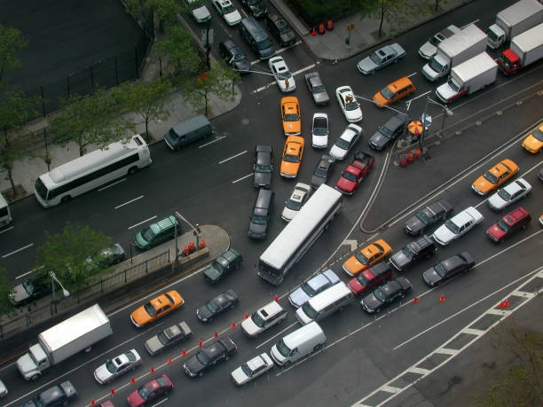 High angle view of manhattan New York motor vehicles entering the queens midtown tunnel on first and Second Avenues and 36th Street Gridlock at the manhattan side of the new york queens midtown tunnel traffic jam stock pictures, royalty-free photos & images