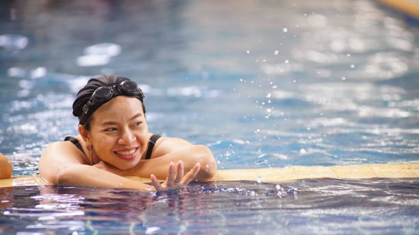 istock Asia women swimming .She is a happy exercise. 1139211296